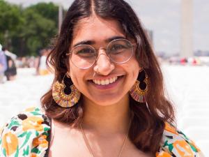 Shree, a young Indian woman with brown hair, smiling.