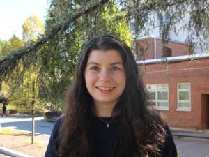 Molly, a young white women with long brown hair