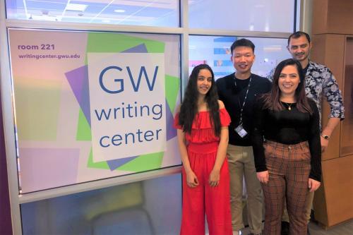 Students and consultants taking pictures outside the writing center