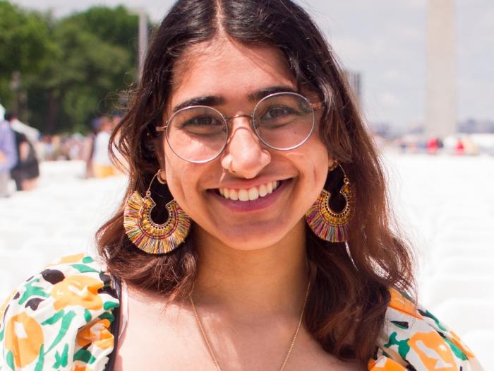 Shree, a young Indian woman with brown hair, smiling.